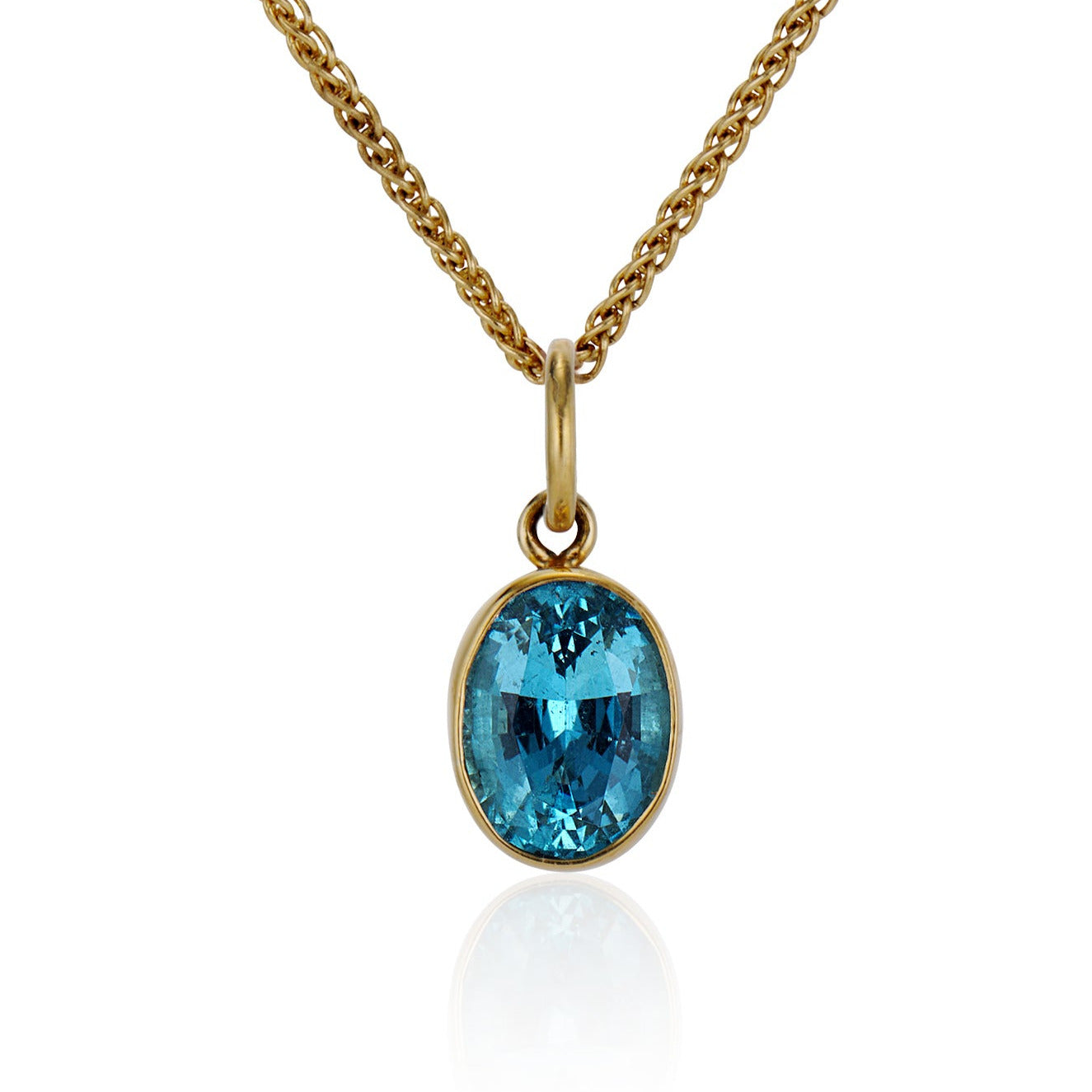 Gold chain with a Santa Maria Aquamarine on a white background