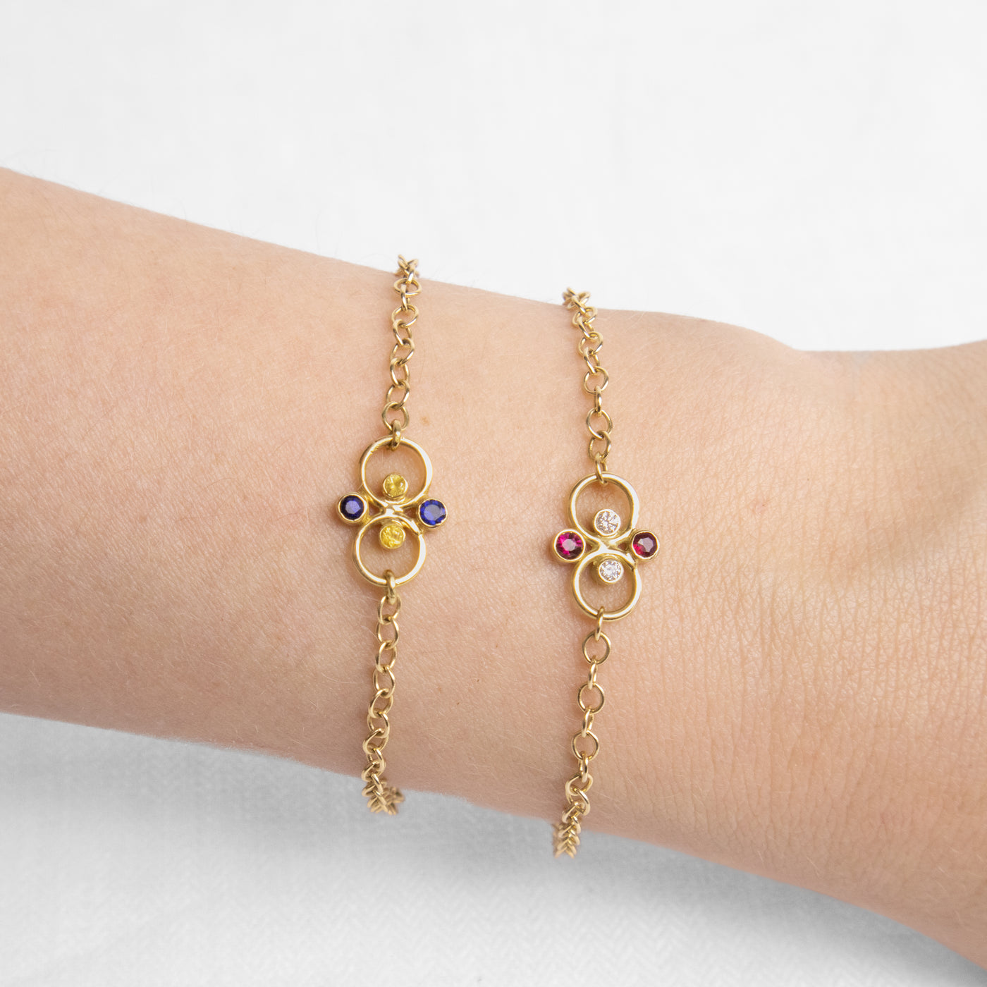 Ruby and diamond and sapphires bracelets on wrist