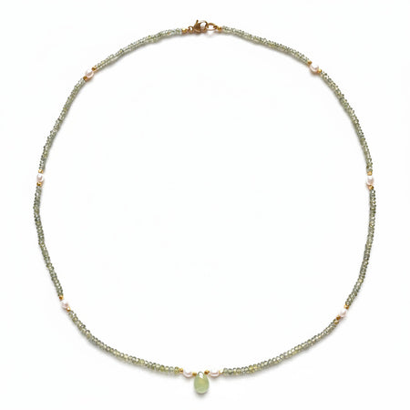 Round green sapphire and pearl beaded necklace on white