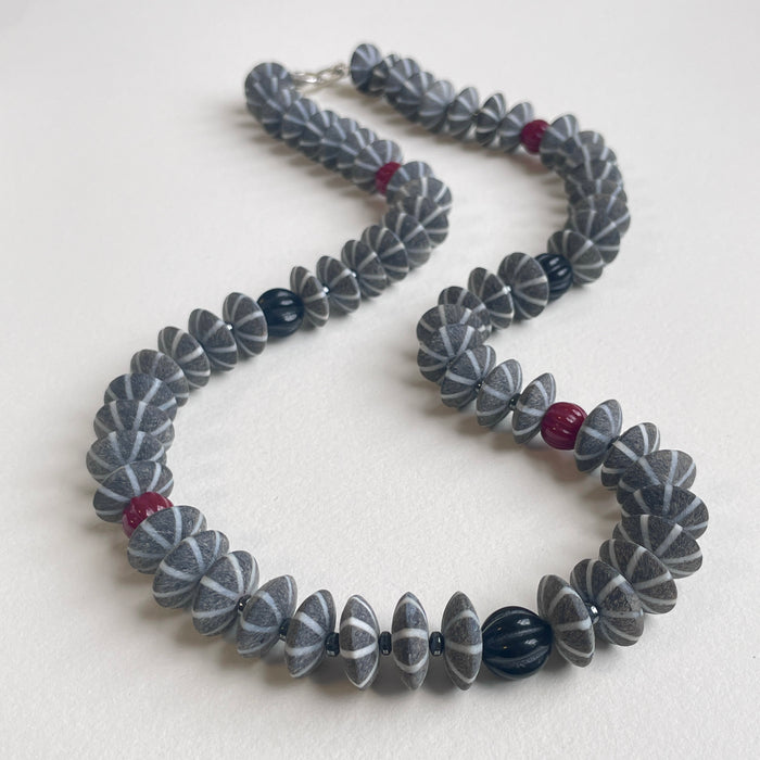 Buffalo Horn, Carved Coral and Onyx, and Hematite Necklace