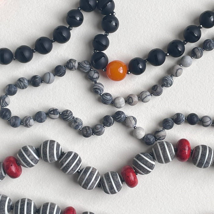Banded Black Onyx Orbs with Hematite and Resin