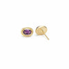 Gold earrings with a purple sapphire showing back of earring
