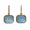 Pair of earrings with octagonal silver charms on a white background