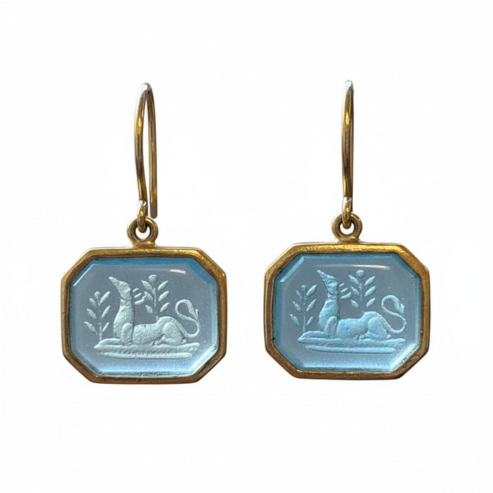 Pair of earrings with octagonal silver charms on a white background